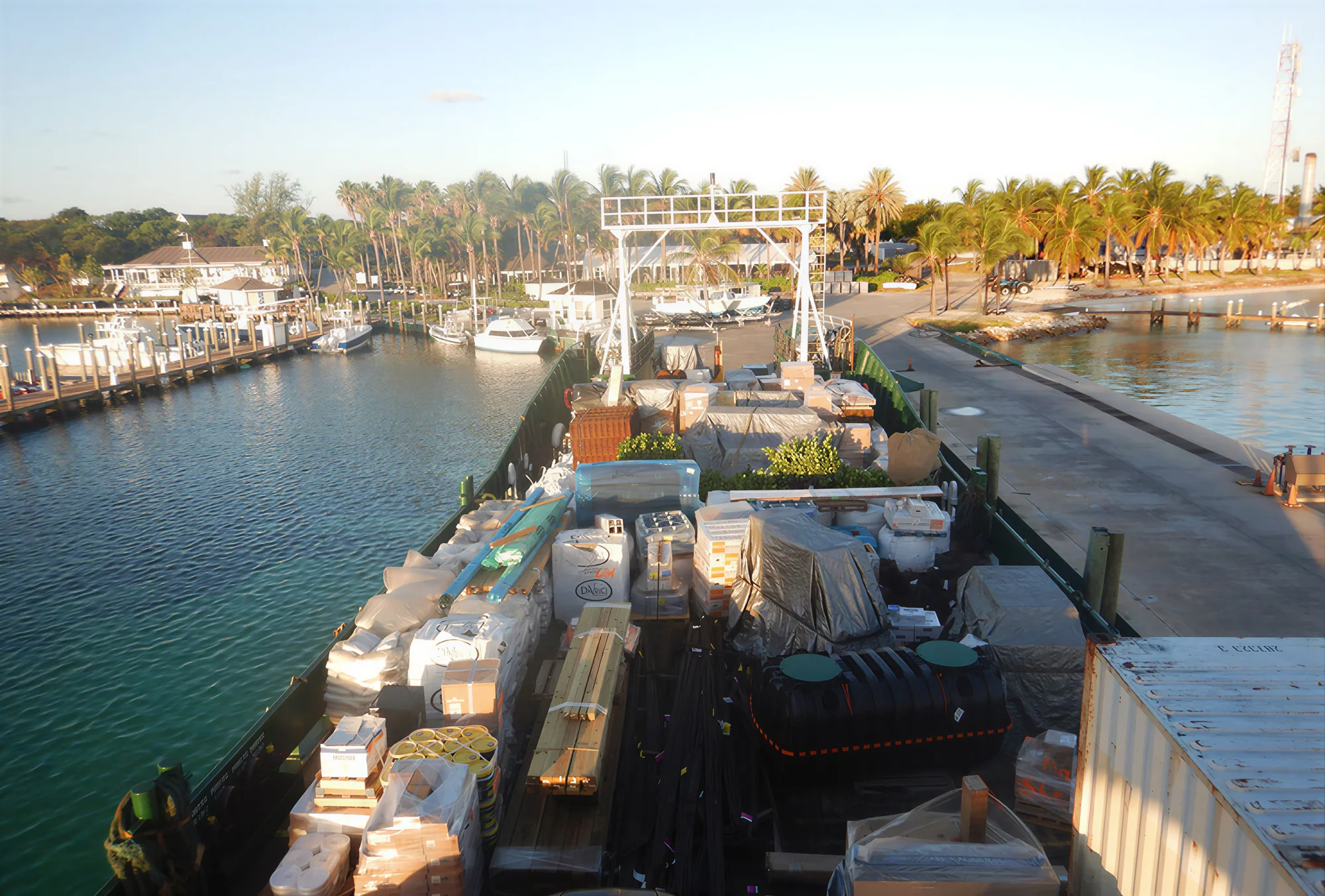 A loaded Bimini Shipping vessel alongside an island dock